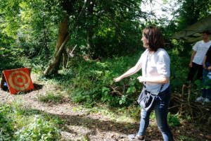 Lucy, people manager, takes on axe throwing. 