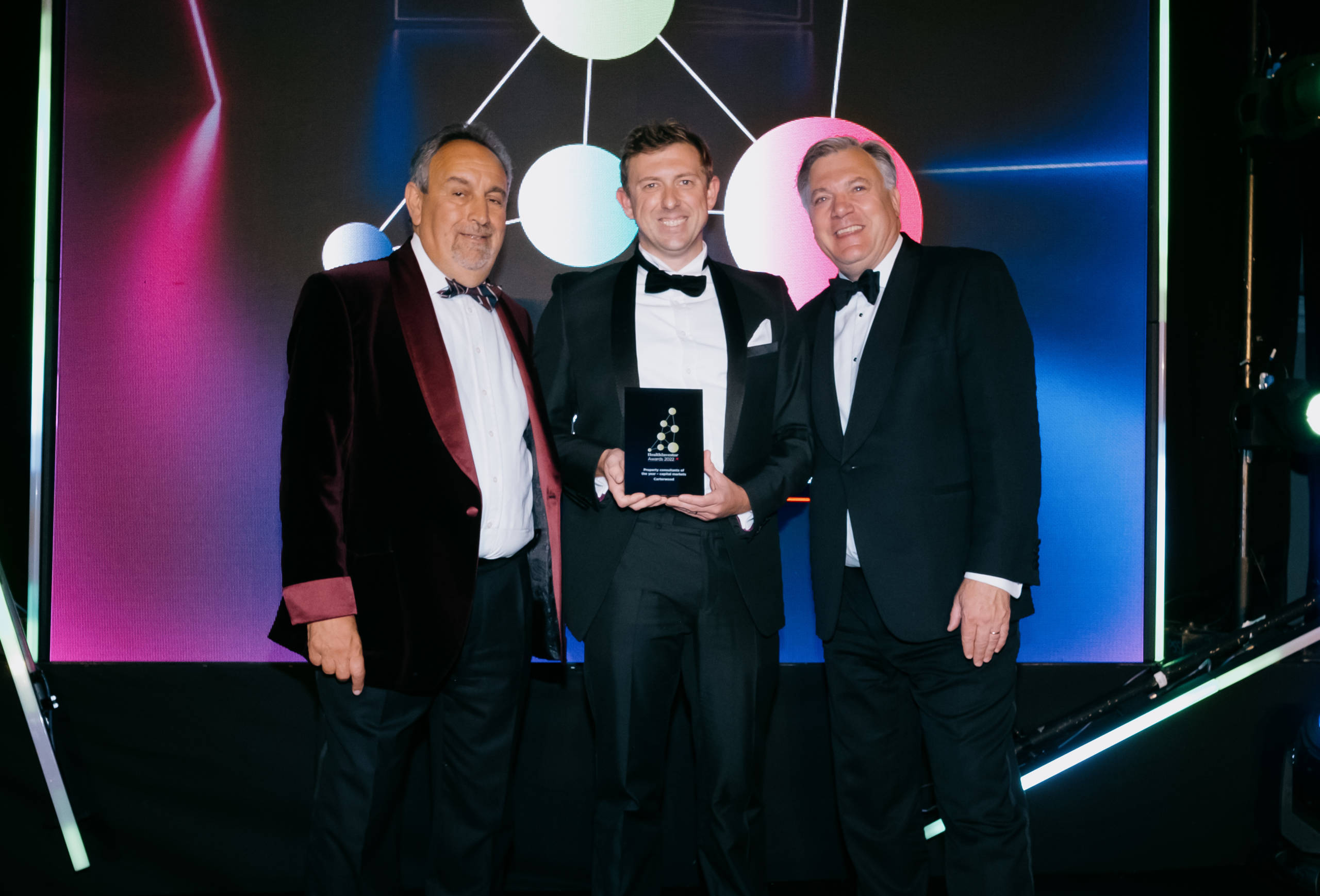 Tom Hartley, managing director at Carterwood (centre) with Harry Hyman, publisher at Investor Publishing (left) and Ed Balls, broadcaster, writer, economist, professor and former politician (right) at the HealthInvestor Awards 2022